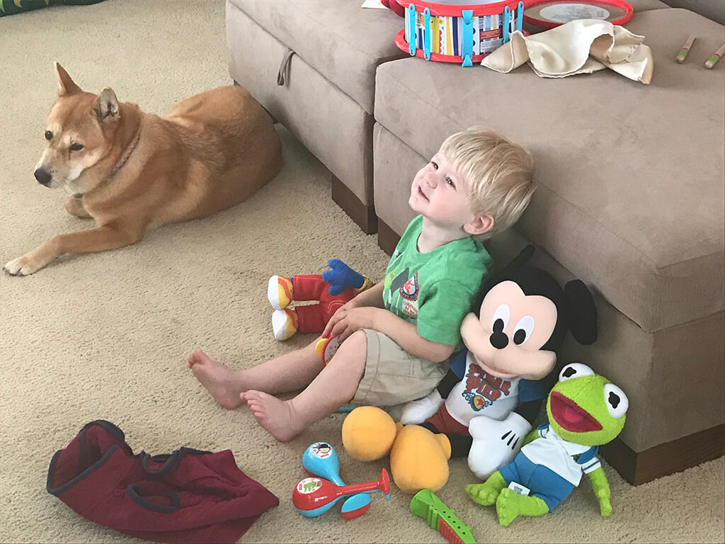 parenting son watches tv while mom works
